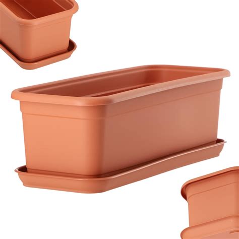 Jardinière en terre cuite de 60 cm avec des plantes