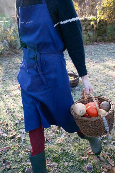 Tablier de jardinier bleu avec outils