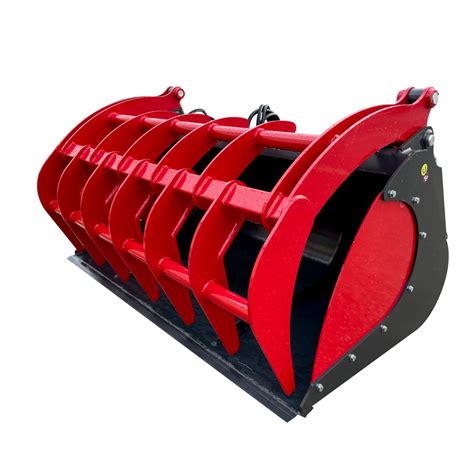 Chargeur agricole chargeant du fumier avec un godet pélican