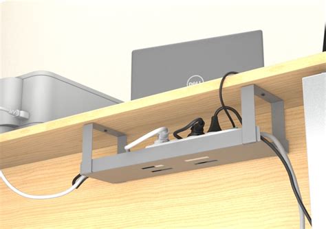 Système de rangement de câbles sous un bureau