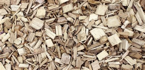 Illustration d'un oreiller en copeaux de bois posé sur un lit en bois naturel
