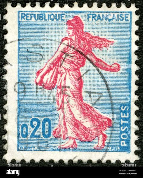 Timbre Semeuse française avec détail de la main