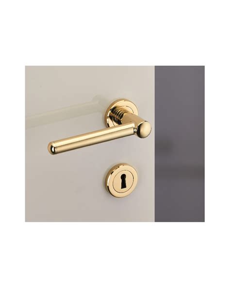 Poignée de porte en laiton avec des motifs symboliques
