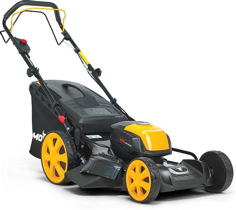 Tondeuse à gazon à batterie en action dans un jardin paysager