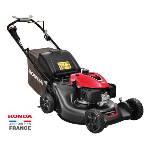 Tondeuse thermique Honda en action sur une pelouse bien entretenue