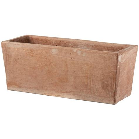 jardinière rectangulaire en terre cuite émaillée sur une terrasse moderne