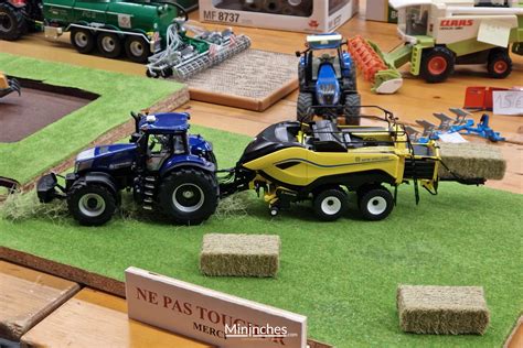 Vue d'ensemble d'une collection de miniatures agricoles Siku sur un diorama