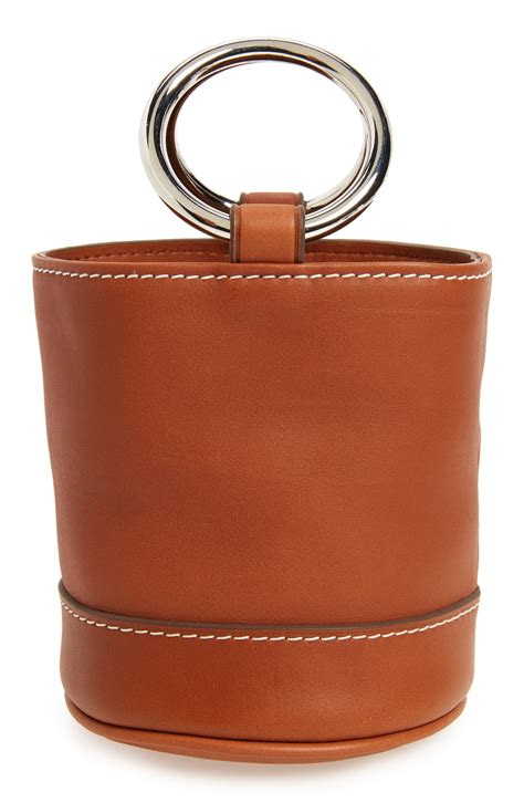 Close-up of the Simon Miller Bonsai bag's leather texture and metal hoops