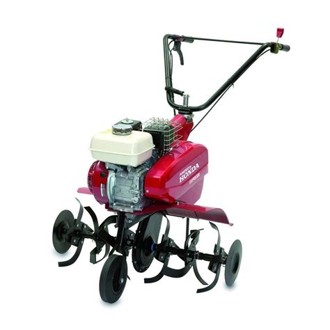 Vue d'ensemble de la motobineuse Honda FG 320 dans un potager bien entretenu