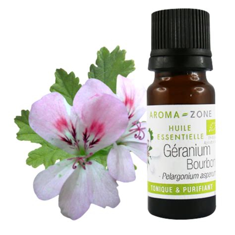 Bouteille d'huile essentielle de géranium bourbon avec feuilles