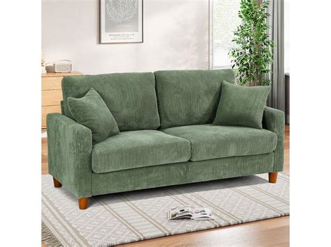 Canapé velours vert de gris avec pastels