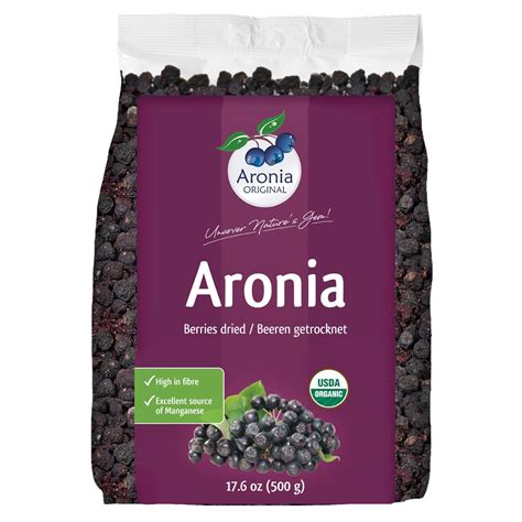 Various aronia products: juice, jam, dried berries