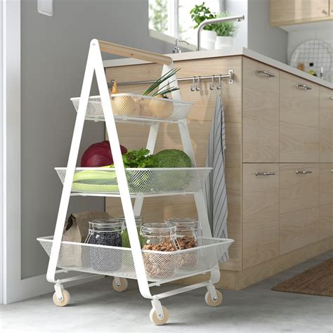 Ikea RISATORP rolling cart in a kitchen setting with various fruits and vegetables