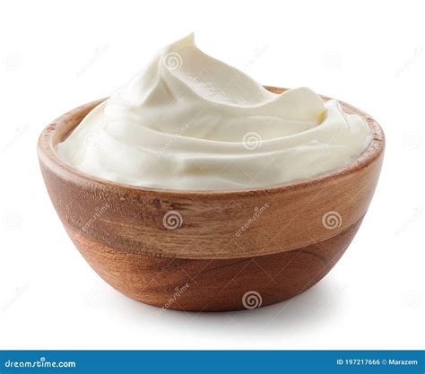 Bol de crème fouettée et spatule en bois